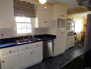 Appealing blue and yellow kitchen with lots of sto
