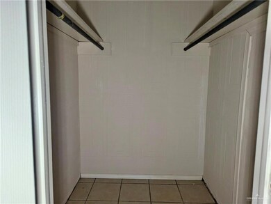 Walk in closet featuring light tile patterned flooring