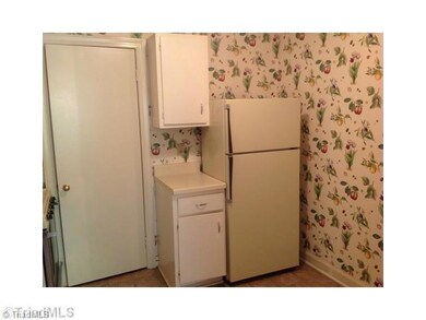 Kitchen. Appliances include gas stove, refrigerator, dishwasher & disposal