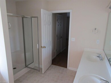 Master bath looking into hallway to master bath