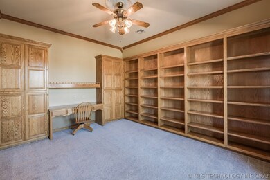 Large study with solid oak built in shelving.