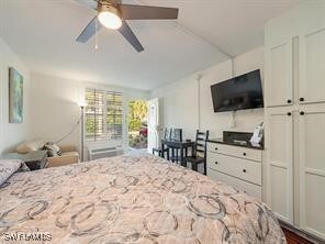 Bedroom featuring ceiling fan and dark wood finished floors