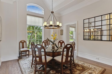 Light and bright dining room with cathedral ceilings.