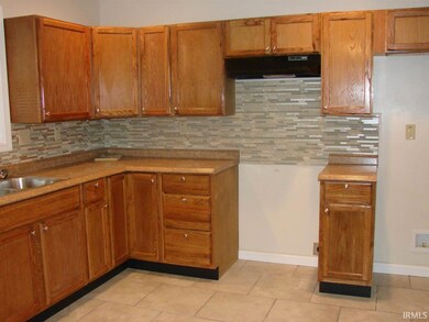 Glass tile backsplash accents the kitchen!
