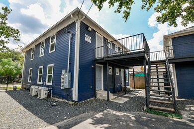 Modern blue four-plex, close to city conveniences.