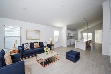 Soaring vaulted ceilings create an airy and light-