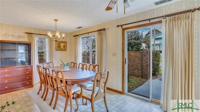 Dining room with sliding door to patio for grillin