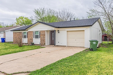 Ranch-style home featuring fence, a garage, concre