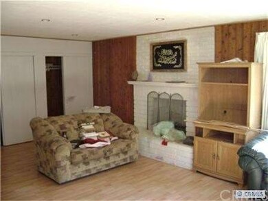 Family room with fireplace can be used as 3rd bedr