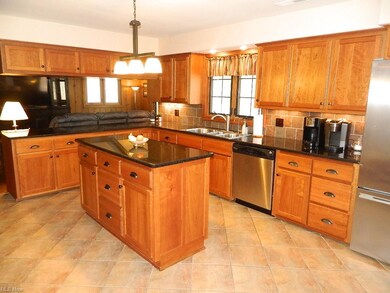 You Will LOVE this Kitchen!  An Abundance of Custom Cabinetry, Granite Counters, Triple Sinks, All Appliances, Ceramic Flooring ...