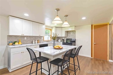 Kitchen offers new cabinets, counters, backsplash,