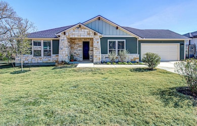 View of front of property with driveway, a front 
