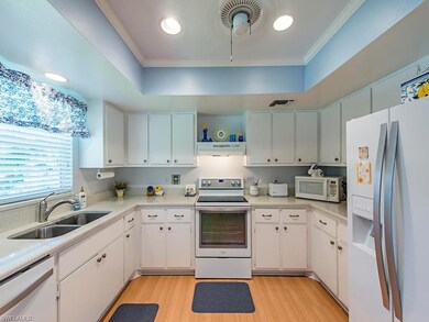Kitchen, window overlooks landscaped area