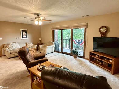 Living Room and triple Pella slider to balcony