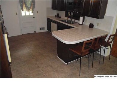 The kitchen with the new floors is nice and large 