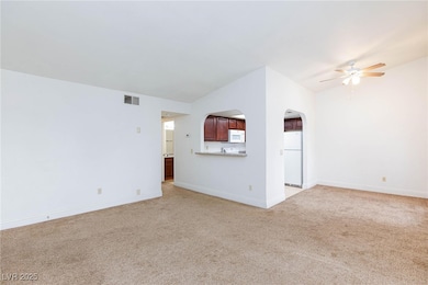 Unfurnished living room with visible vents, light
