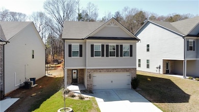 View of front of home featuring a garage, a front 