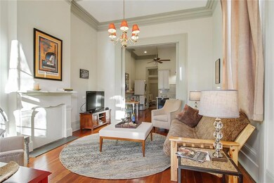 Living room with plaster crown molding, medallion,