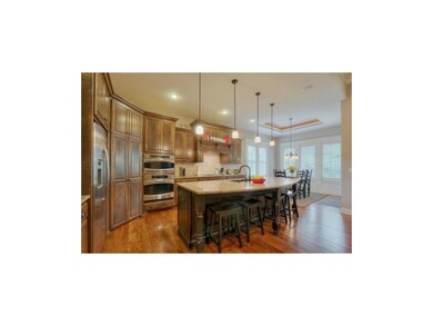 Great room is open to the chef's dream eat-in kitc