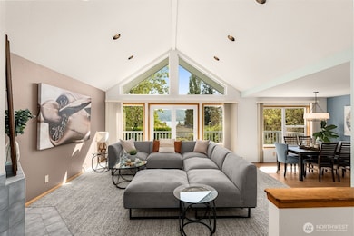 Soaring ceiling over living room with a wall of windows to capture the views