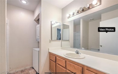 Bathroom with vanity and recessed lighting