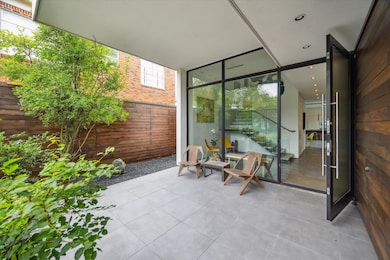 The front courtyard offers privacy and a quiet res