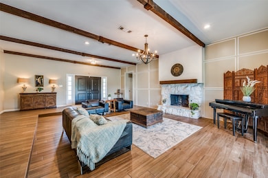 Stone fireplace with wood mantle.