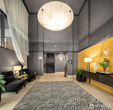 Lobby area of Harbour Heights. Elevators to the right, and mailboxes up 1/2 flight of stairs.