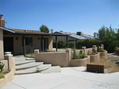 COVERED PATIO, PLANTERS, HORSESHOE PIT AND THE FRE