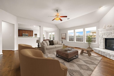 Living area featuring dark wood-type flooring, vi