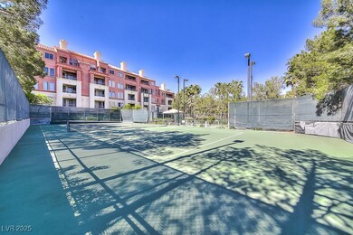 View of sport court featuring fence