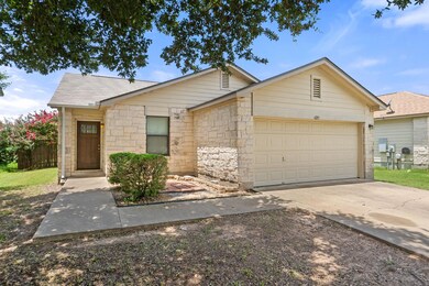 Ranch-style house featuring a shingled roof, a ga