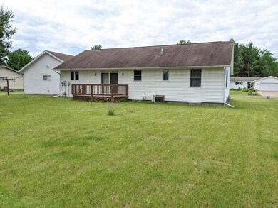 Back of home with nice deck.
