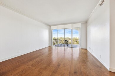 Living room with hardwood floors, crown molding, s