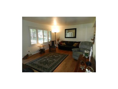 Spacious living room with big picture window.
