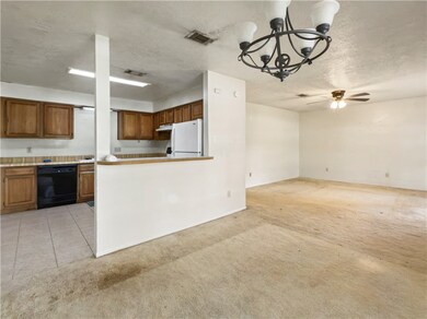 Kitchen featuring freestanding refrigerator, black