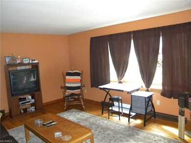 Extra large bay window and gorgeous wood floors in