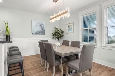 New light fixtures add the designer touch to beach view dining room.