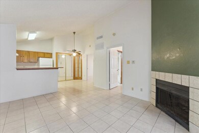 Unfurnished living room featuring a tile fireplace
