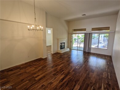 Unfurnished living room with a chandelier, a high