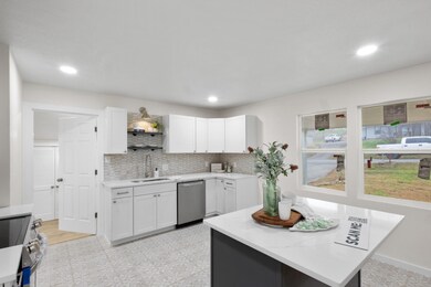 Kitchen featuring stainless steel appliances, tast