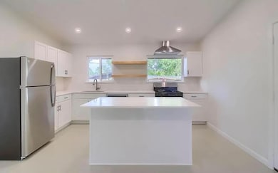 Kitchen with a sink, appliances with stainless st