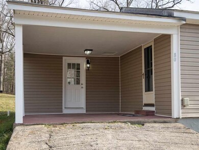 This home features a carport area.  This space fea