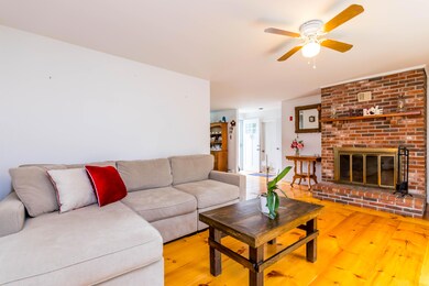 Living room with wood burning fireplace