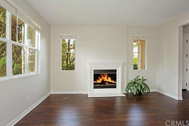 NEW wood floors and tranquil fireplace complete th