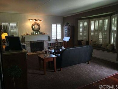 Entry opens to formal living room with large bay w