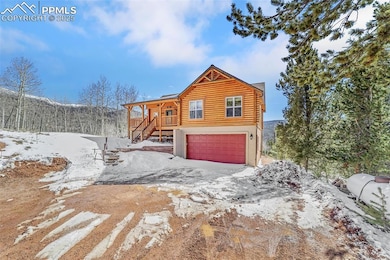 Log home with stucco siding, a garage, log exterio