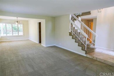 Step into a formal living and dining room space wi