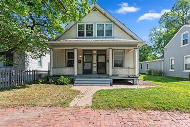 Covered porch with dual porch swings.