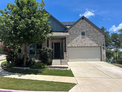 View of front of home with solar panels, concrete